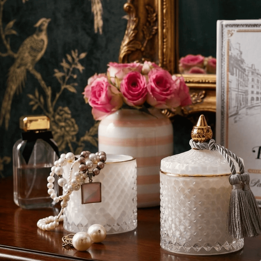 Decorative scented candle in a white and gold crystal glass container